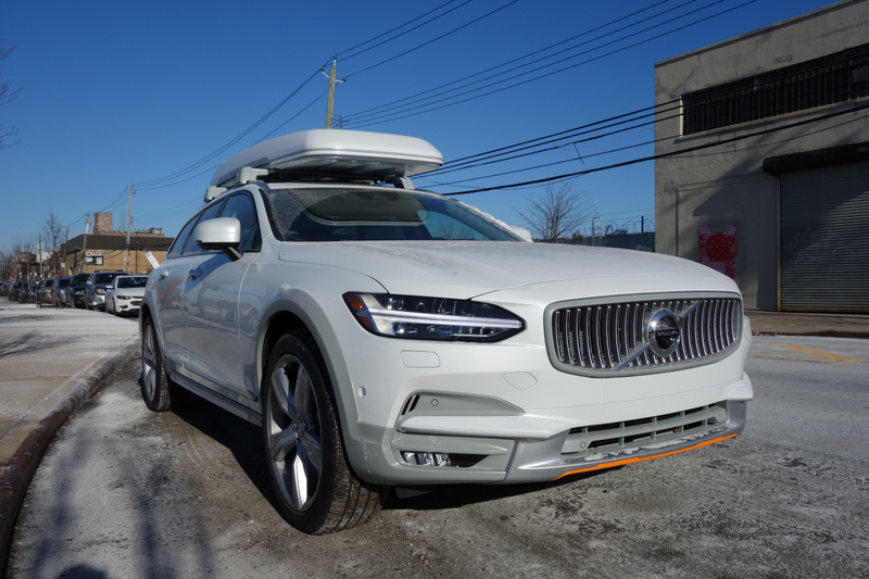 Illustration for article titled The Volvo V90 Cross Country Has Orange Seatbelts and a $3,300 Cargo Box and I Love It